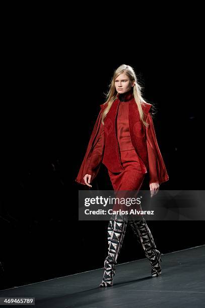 Model showcases designs by Martin Lamothe on the runway at Martin Lamothe show during Mercedes Benz Fashion Week Madrid Fall/Winter 2014 at Ifema on...