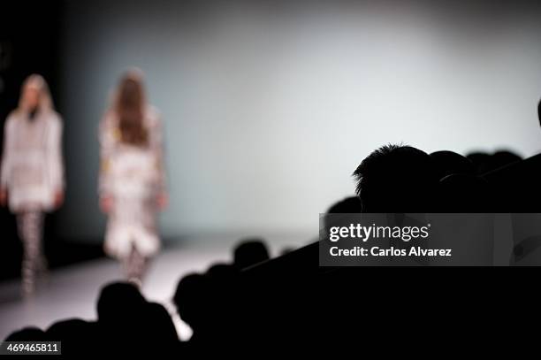 Models showcase designs by Martin Lamothe on the runway at Martin Lamothe show during Mercedes Benz Fashion Week Madrid Fall/Winter 2014 at Ifema on...