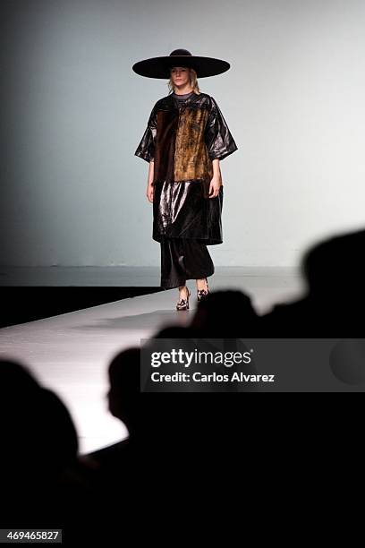 Model showcases designs by Martin Lamothe on the runway at Martin Lamothe show during Mercedes Benz Fashion Week Madrid Fall/Winter 2014 at Ifema on...