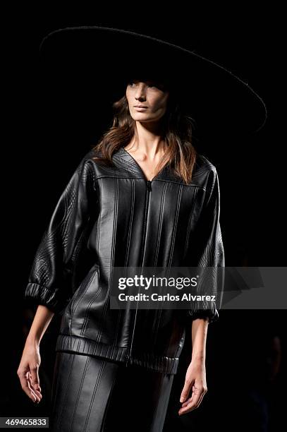 Model showcases designs by Martin Lamothe on the runway at Martin Lamothe show during Mercedes Benz Fashion Week Madrid Fall/Winter 2014 at Ifema on...