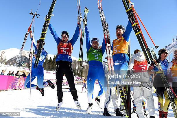 Silver medalists Krista Lahteenmaki, Anne Kylloenen, Aino-Kaisa Saarinen and Kerttu Niskanen of Finland celebrate after the Women's 4 x 5 km Relay...