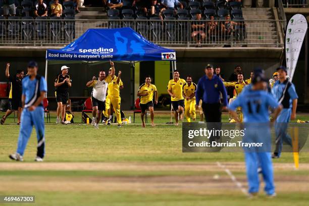 Western Australia players celebrate the winning runs during the Imparja Cup Final between Western Australia and New Soth Wales at Traeger Park on...