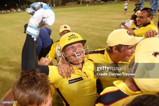 Bevan Bennell of Western Australia celebrates with ream mates after the Imparja Cup Final between Western Australia and New South Wales at Traeger...