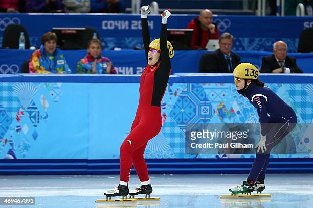 Yang Zhou of China celebrates winning the gold medal from Suk Hee Shim of South Korea during the Ladies' 1500 m Final Short Track Speed Skating on...