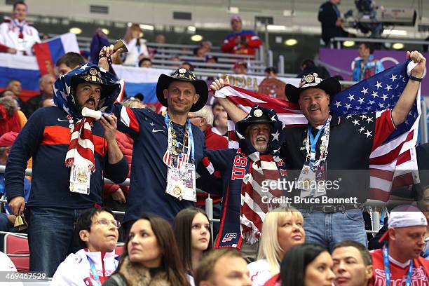 American fans attend the Men's Ice Hockey Preliminary Round Group A game against Russia on day eight of the Sochi 2014 Winter Olympics at Bolshoy Ice...