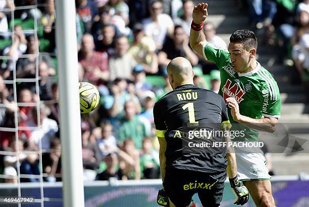 Saint-Etienne's Turkish forward Mevlut Erding vies with Nantes' French goalkeeper Remy Riou during the French L1 football match Saint-Etienne vs...