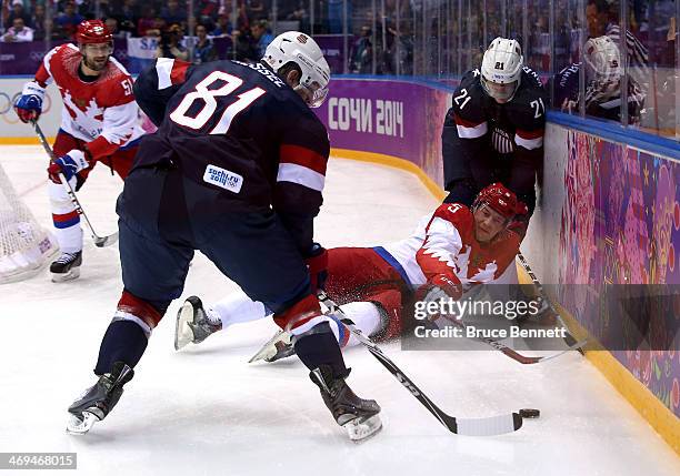 Ilya Nikulin of Russia falls to the ice against Phil Kessel and James van Riemsdyk of United States during the Men's Ice Hockey Preliminary Round...