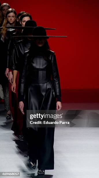 Models showcases designs by Martin Lamothe on the runway at Martin Lamothe show during Mercedes Benz Fashion Week Madrid Fall/Winter 2014 at Ifema on...