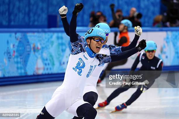 Victor An of Russia celebrates after winning the gold medal during the Men's 1000 m Final Short Track Speed Skating on day 8 of the Sochi 2014 Winter...