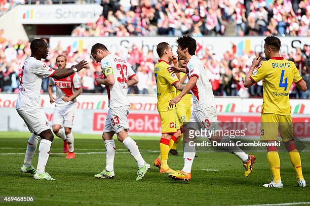 Matthias Lehmann of 1. FC Koeln celebrates as he scores the opening goal from a penalty during the Bundesliga match between 1. FC Koeln and 1899...