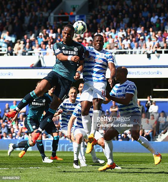 Didier Drogba of Chelsea and Nedum Onuoha of QPR compete for the ball during the Barclays Premier League match between Queens Park Rangers and...