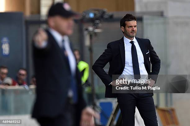 Head coach Andrea Stramaccioni of Udinese looks on as head coach Giuseppe Iachini of Palermo issues instructionsduring the Serie A match between...