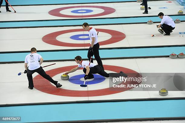 Britain's Scott Andrews throws the stone during the Men's Curling Round Robin Session 9 match Great Britain vs Canada at the Ice Cube Curling Center...