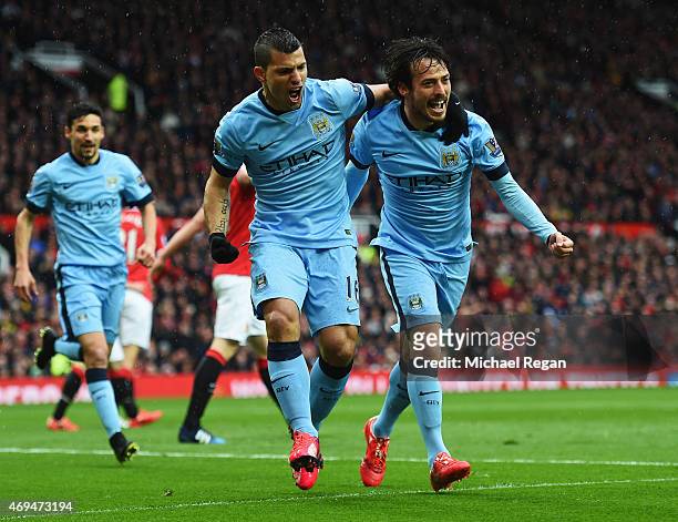 Sergio Aguero of Manchester City celebrates with David Silva and team mates as he scores their first goal during the Barclays Premier League match...
