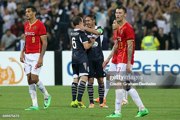 Leigh Broxham and Mark Milligan of the Victory celebrate winning the AFC Champions League playoff match between the Melbourne Victory and Muangthong...