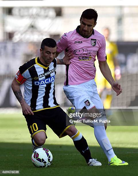 Antonio Di NAtale of Udinese and Sinisa Andelkovic of Palermo compete for the ball during the Serie A match between Udinese Calcio and US Citta di...