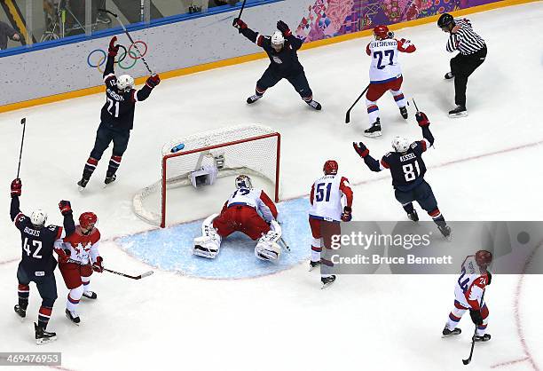 Cam Fowler of the United States celebrates with teammates after scoring a goal against Sergei Bobrovski of Russia in the second period during the...