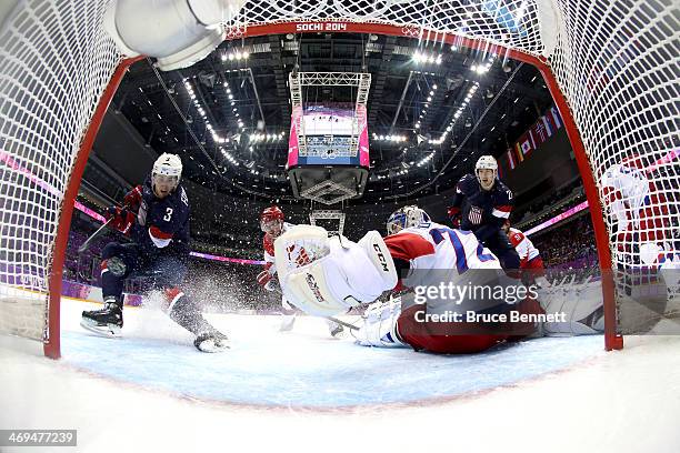 Cam Fowler of the United States scores a goal against Sergei Bobrovski of Russia during the Men's Ice Hockey Preliminary Round Group A game on day...