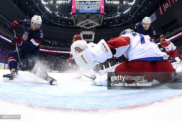 Cam Fowler of the United States scores a goal against Sergei Bobrovski of Russia during the Men's Ice Hockey Preliminary Round Group A game on day...