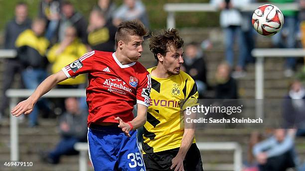 Dominik Widemann of Unterhaching and Jon Gorenc-Stankovic of Dortmund jump for a header during the 3. Liga match between Borussia Dortmund II and...