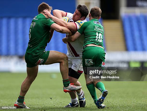 Marc Jones of Sale is tackled by Alex Lewington and Chris Noakes of London Irish during the Aviva Premiership match between London Irish and Sale...