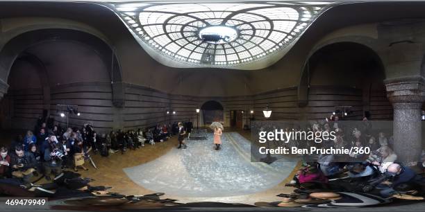 Model walks the runway during the Orla Kiely presentation at London Fashion Week AW14 at Central Saint Martins on February 15, 2014 in London,...