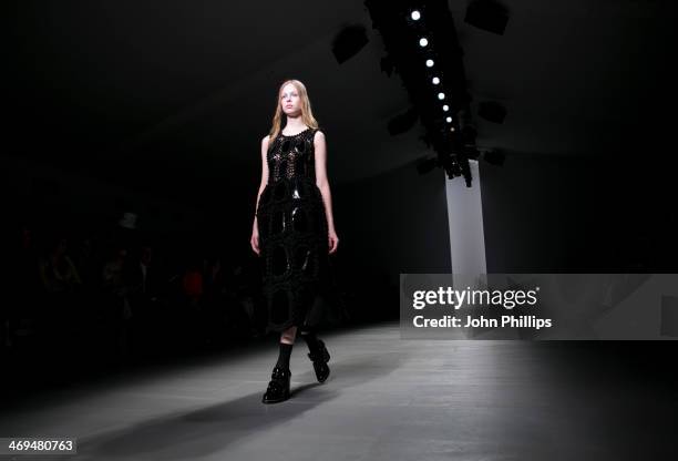 Model walks the runway at the John Rocha show at London Fashion Week AW14 at Somerset House on February 15, 2014 in London, England.