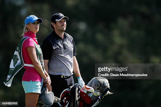 Thomas Aiken of South Africa and his caddie Kate Aiken look on before he hits his second shot on the 15th hole during Day 3 of the Africa Open at...