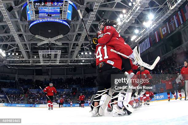 Team Switzerland celebrate winning 2-0 against Russia during the Women's Ice Hockey Playoffs Quarterfinal game on day eight of the Sochi 2014 Winter...