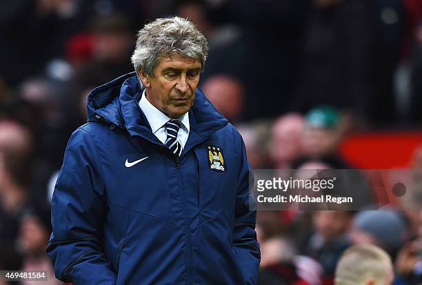 Manuel Pellegrini manager of Manchester City looks depsondetn in defeat after the Barclays Premier League match between Manchester United and...