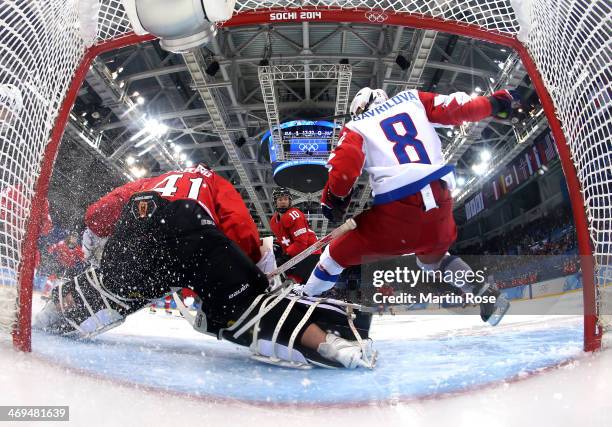 Florence Schelling of Switzerland saves a goal against Russia during the Women's Ice Hockey Playoffs Quarterfinal game on day eight of the Sochi 2014...