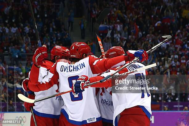 Alexander Ovechkin and Ilya Kovalchuk of Russia celebrate with teammates after Pavel Datsyuk scored a third-period goal against the United States...
