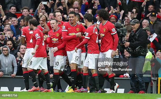 Chris Smalling of Manchester United celebrates scoring their fourth goal during the Barclays Premier League match between Manchester United and...