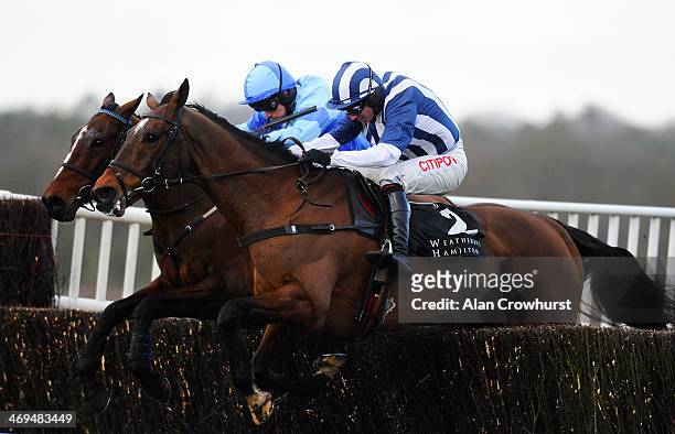 Charlie Poste riding Restless Harry clear the last to win The Weatherbys Hamilton Insurance Steeple Chase from Teaforthree at Ascot racecourse on...