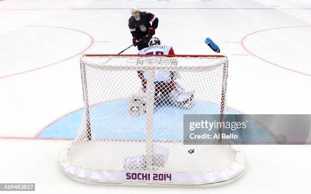 Oshie of the United States scores on a shootout against Sergei Bobrovski of Russia to win the Men's Ice Hockey Preliminary Round Group A game on day...