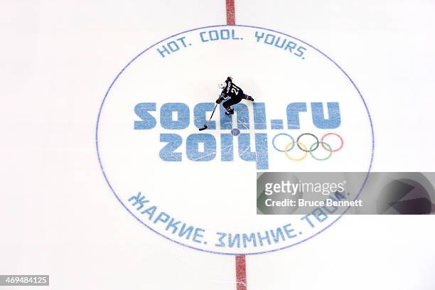 James van Riemsdyk of the United States skates across the center logo in a shootout against Russia during the Men's Ice Hockey Preliminary Round...