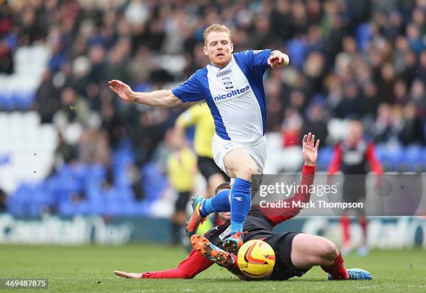 Chris Burke of Birmingham tangles with Anthony Gerrard of Huddersfield Town during the Sky Bet Championship match between Birmingham City and...