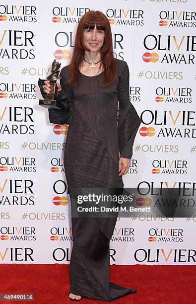 Sylvie Guillem, winner of the Special Award, poses in the winners room at The Olivier Awards at The Royal Opera House on April 12, 2015 in London,...