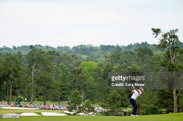 Justin Rose of England hits his second shot on the second hole during the final round of the 2015 Masters Tournament at Augusta National Golf Club on...