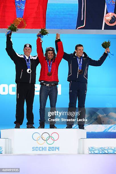 Silver medalist Ivica Kostelic of Crioatia, gold medalist Sandro Viletta of Switzerland and bronze medalist Christof Innerhofer of Italy celebrate on...