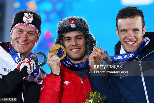 Silver medalist Ivica Kostelic of Crioatia, gold medalist Sandro Viletta of Switzerland and bronze medalist Christof Innerhofer of Italy celebrate on...