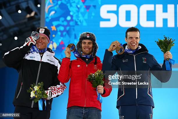 Silver medalist Ivica Kostelic of Crioatia, gold medalist Sandro Viletta of Switzerland and bronze medalist Christof Innerhofer of Italy celebrate on...