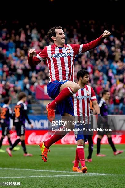 Diego Godin of Atletico de Madrid jumps, celebrating scoring their third goal during the La Liga match between Club Atletico de Madrid and Real...