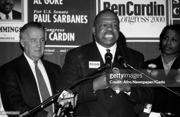 Half length portrait of US Representative Elijah Cummings, flanked by a man and a woman, speaking at the 2000 primary election, Maryland, March 11,...