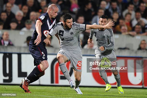 Marseille's French forward Andre-Pierre Gignac vies with Bordeaux's French defender Nicolas Pallois during the French L1 football match between...