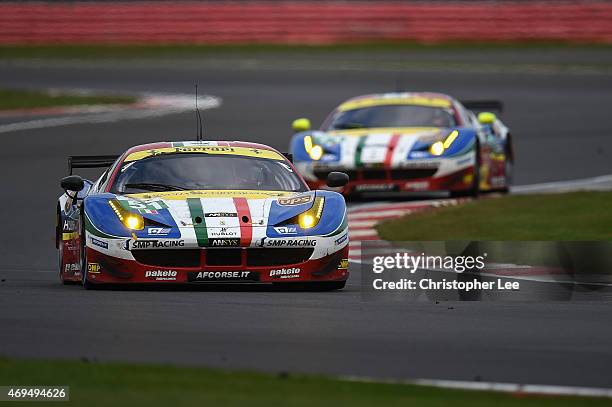 Corse cars driven by Gianmaria Bruni of Italy and Toni Vilander of Finland with team mates Davide Rigon of Italy and James Calado of Great Britain in...