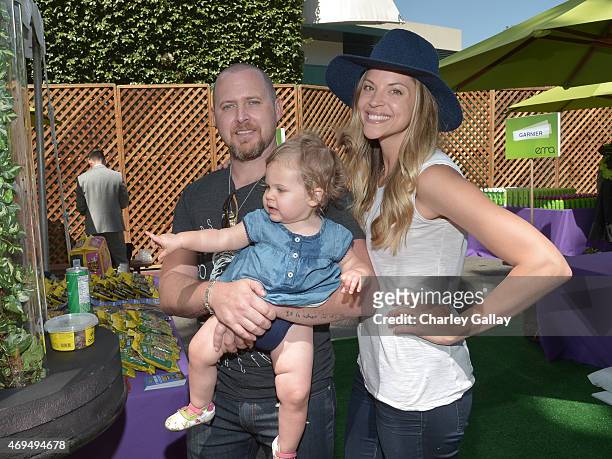 Actor A. J. Buckley, daughter Willow Phoenix Buckley, and Abigail Ochse attend the world premiere Of Disney's "Monkey Kingdom" at Pacific Theatres at...