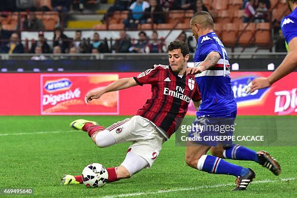 Milan's forward Mattia Destro fights for the ball with Sampdoria's midfielder Angelo Palombo during the Italian Serie A football match between AC...