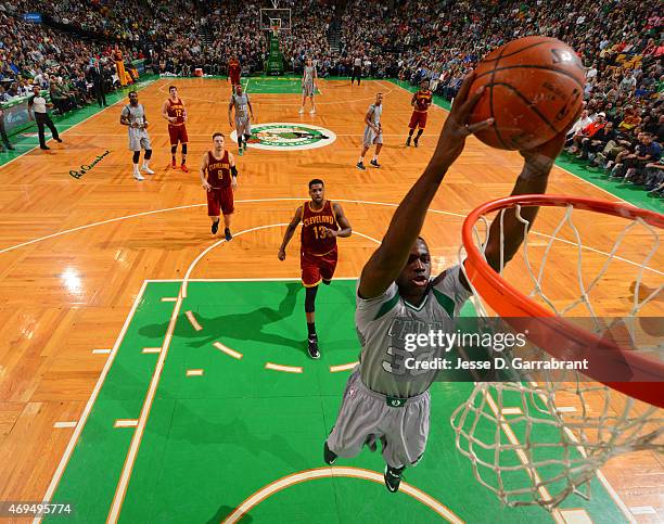 Brandon Bass of the Boston Celtics dunks the ball against the Cleveland Cavilers at the TD Garden on April 12, 2015 in Boston, Massachusetts.NOTE TO...