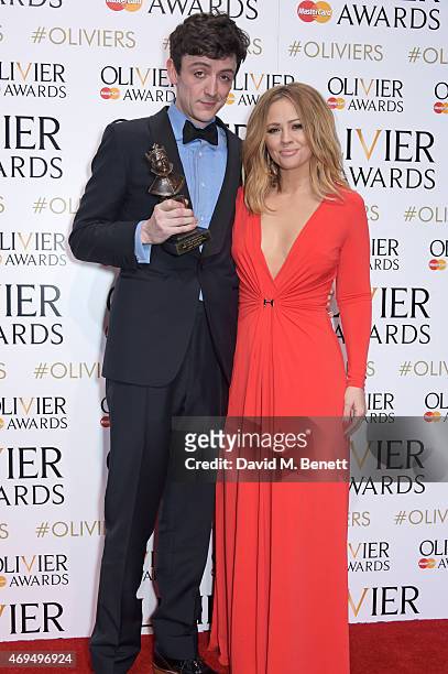 John Dagleish, winner of Best Actor In A Musical for "Sunny Afternoon", and presenter Kimberley Walsh pose in the winners room at The Olivier Awards...
